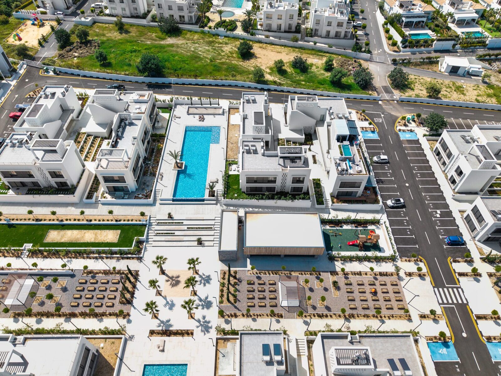 Aerial view of Mediterra long pool and landscaped courtyards